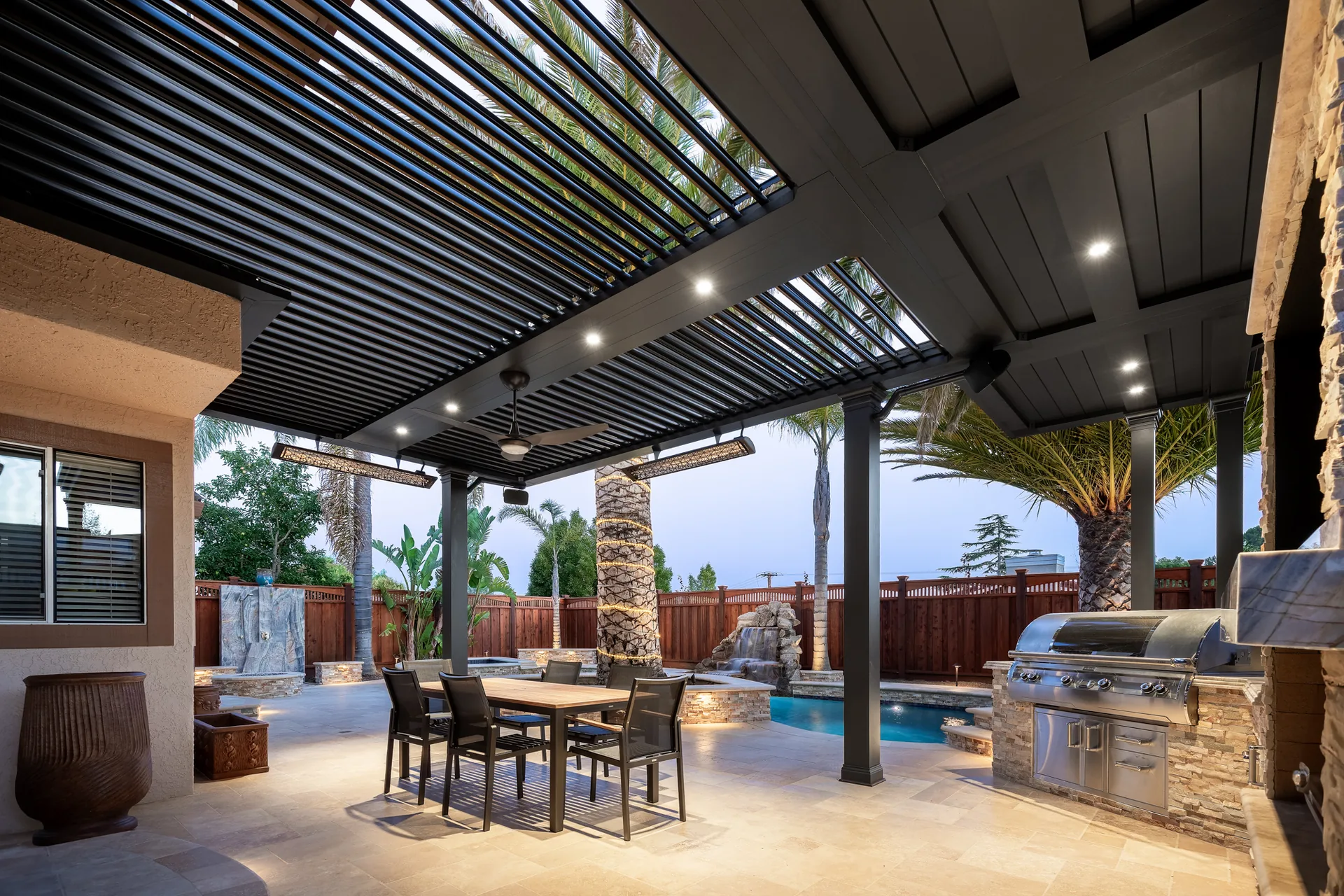 Luxury outdoor kitchen pergola with black cabana